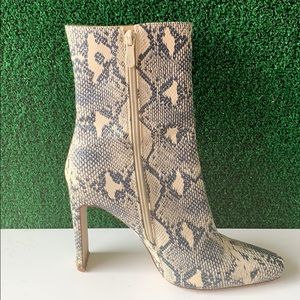 Heeled snake boots